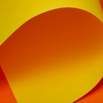 A creative abstract image featuring a vibrant yellow and orange curved paper design.